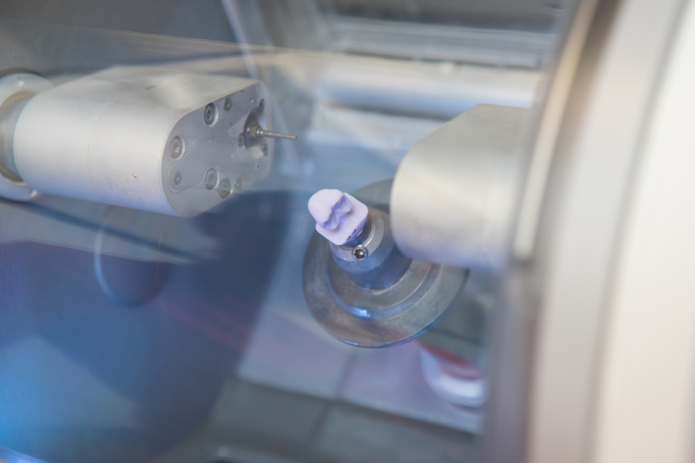 Milling system for creating same day dental crowns featuring a finished crown ready for placement